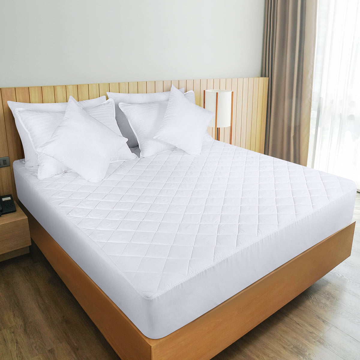 Utopia Bedding quilted mattress pad ready for machine wash care.