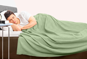 Sage Green decor blanket from Utopia Bedding enhances living room ambiance.