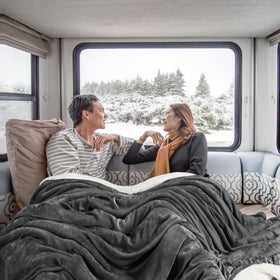 Utopia Bedding Sherpa blanket neatly folded on a bed, highlighting the 2-inch hem.