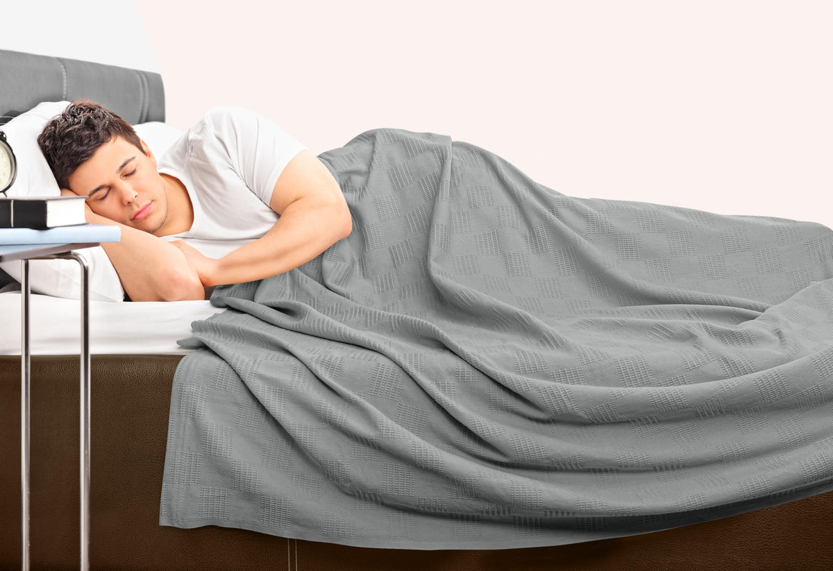 Utopia Bedding thermal blanket pairs with pillows for cozy bed accents.