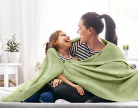 Utopia Bedding thermal blanket draped on bed adds lightweight warmth.