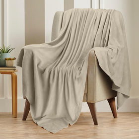 Utopia Bedding khaki blanket folded at foot of bed offers all-season comfort