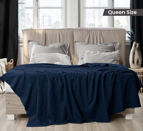 Utopia Bedding navy thermal blanket on couch, versatile cozy layer