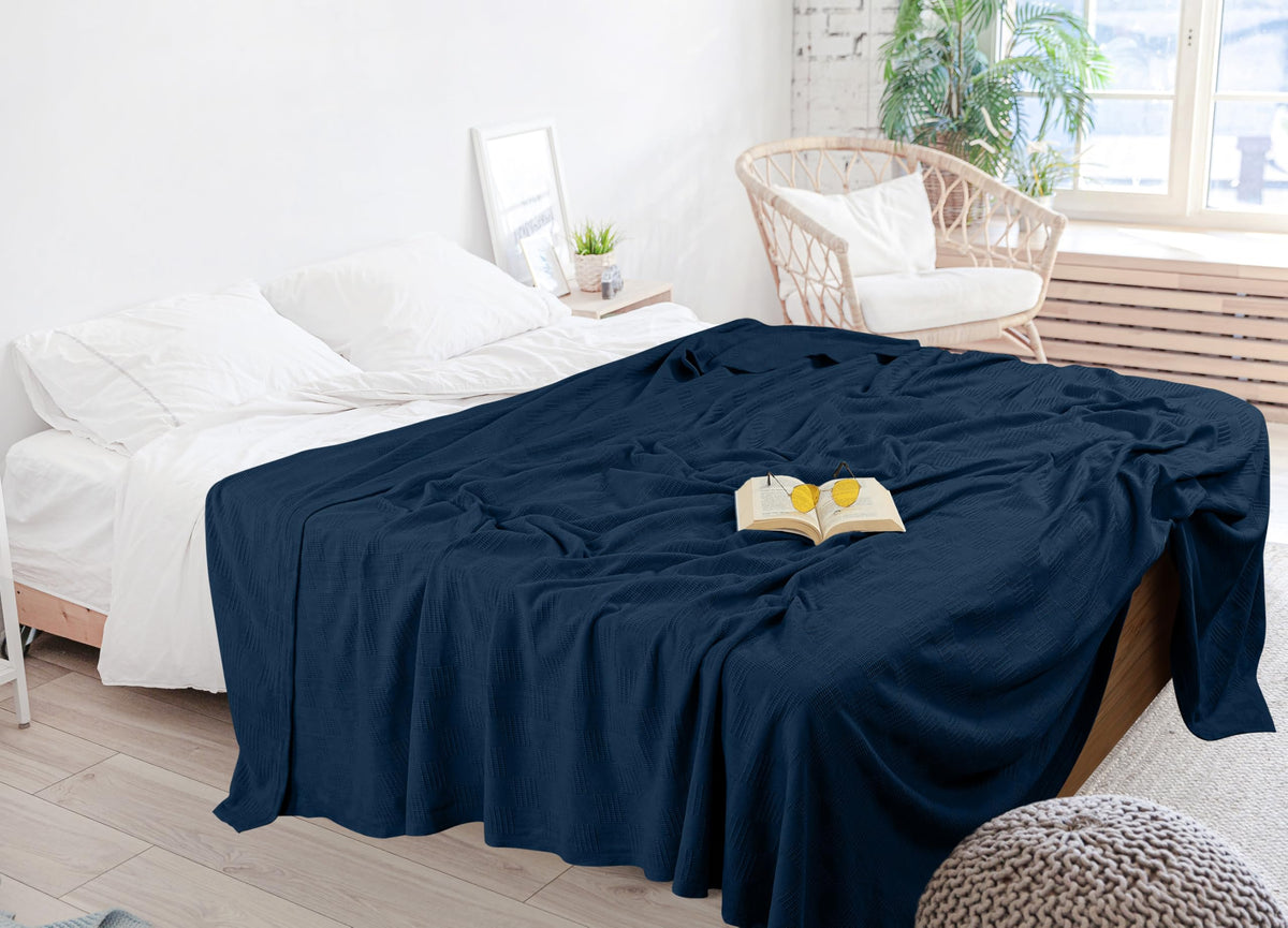 Utopia Bedding navy blanket used as a stylish bedroom throw