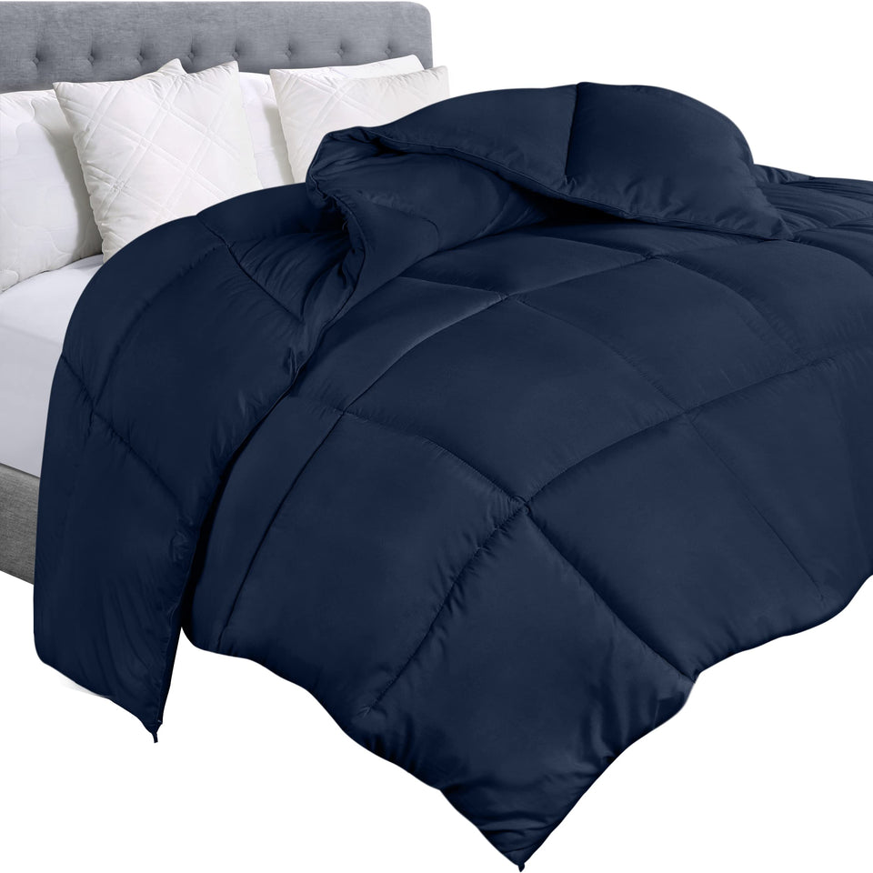 Utopia Bedding twin comforter duvet insert in navy laid on a bed for full coverage.