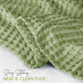 Utopia Bedding waffle blanket folded on bed highlights neat self-binding edging.