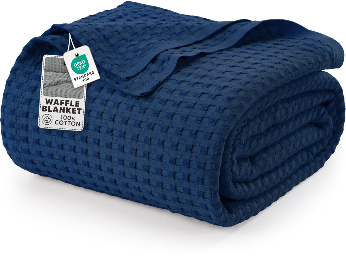 Utopia Bedding navy waffle blanket twin draped on bed for all-season comfort