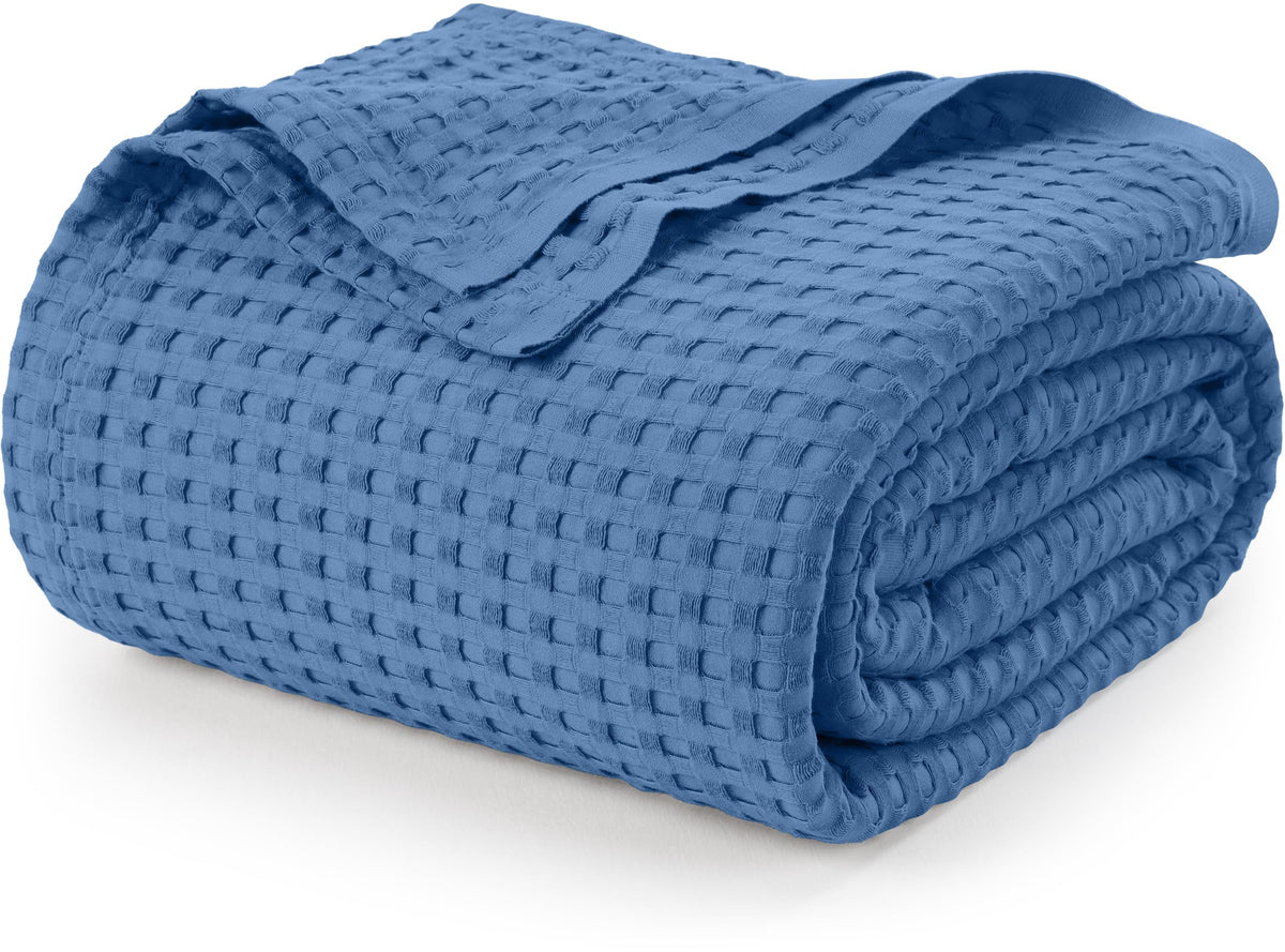 Utopia Bedding waffle blanket draped on a bed, soft and breathable for comfortable nights.
