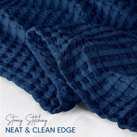 Blanket folded over sofa showing lightweight warmth from Utopia Bedding