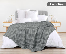 Utopia Bedding blanket draped on couch emphasizes lightweight warmth and breathable weave.