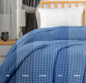 Utopia Bedding wedgewood color blanket draped over bed adds style.