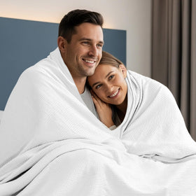 Utopia Bedding white waffle blanket packed for travel, lightweight and portable