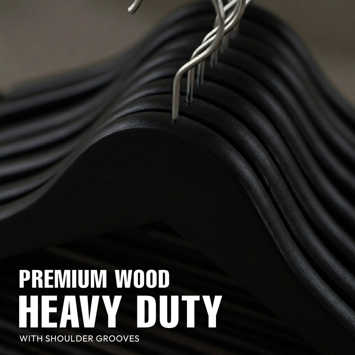 Utopia Home premium wooden hanger featuring contoured shoulders and grooves to protect structured garments.