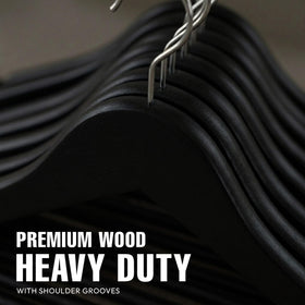 Utopia Home premium wooden hanger featuring contoured shoulders and grooves to protect structured garments.