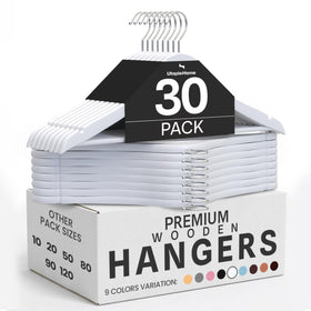 Utopia Home premium wooden hangers show a slim, organized closet.