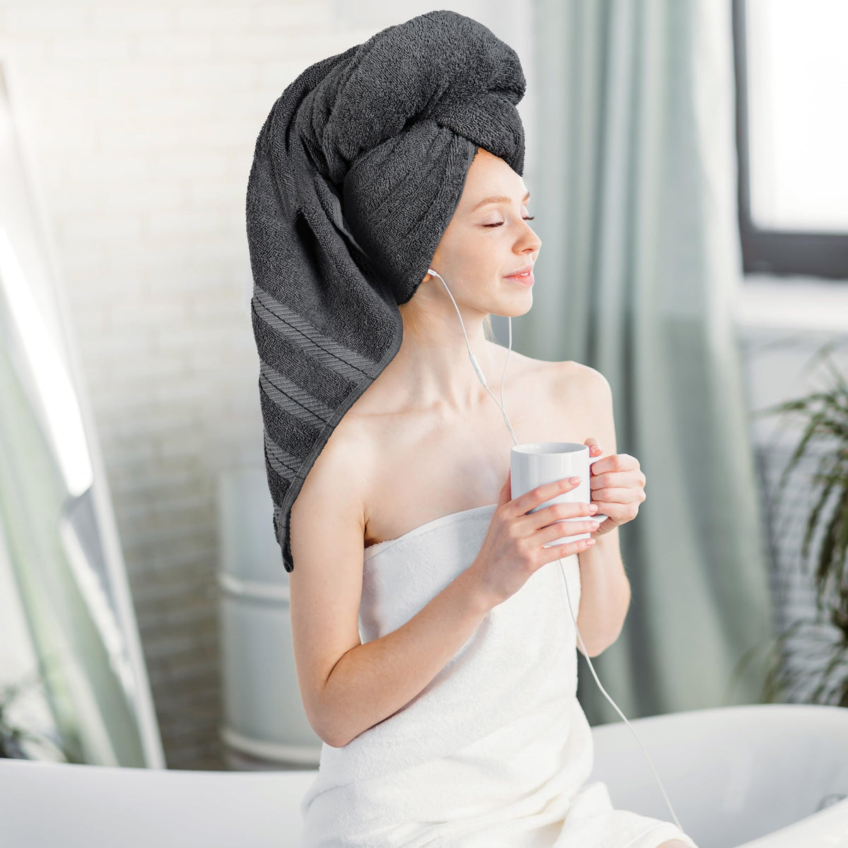 Utopia Towels 30x60-inch grey towel close-up highlights dense weave and softness.