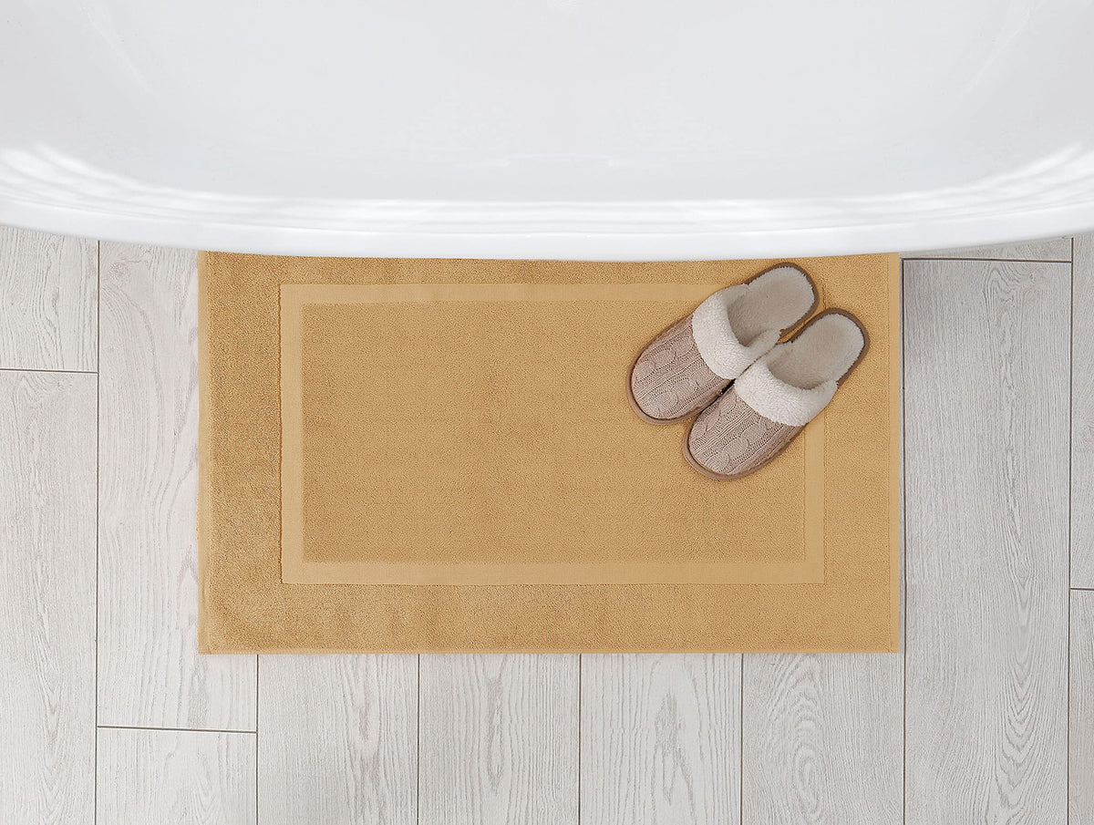 Champagne color rug from Utopia Towels complements neutral bathroom decor.