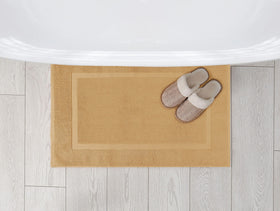 Champagne color rug from Utopia Towels complements neutral bathroom decor.