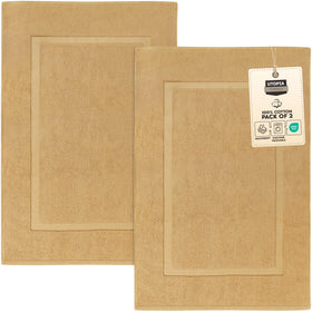 Utopia Towels cotton banded rug in champagne by the tub, soft and absorbent.