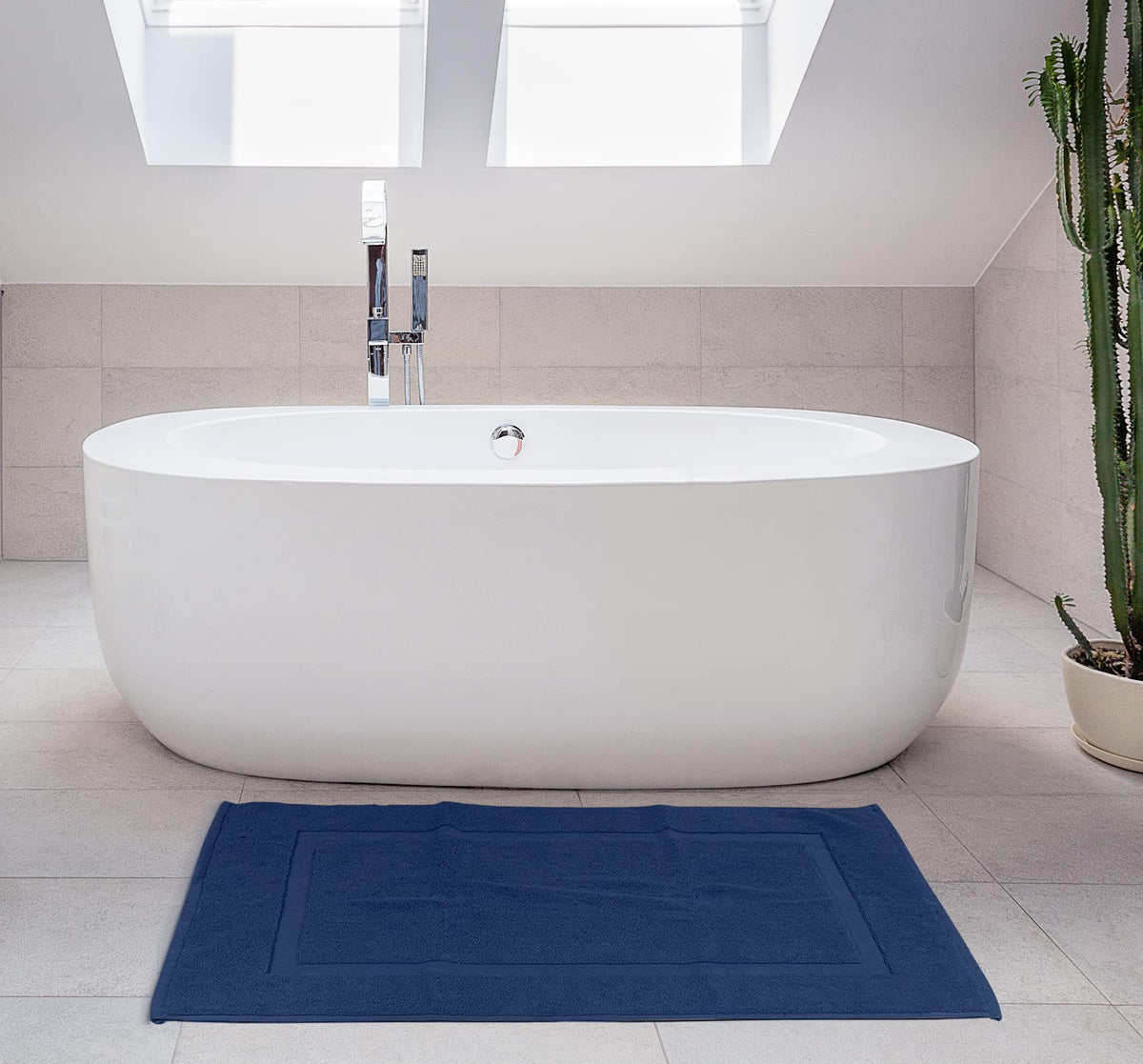 Utopia Towels navy bathroom scene with bath mat.