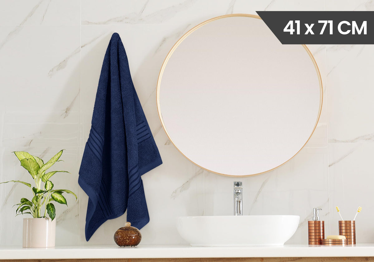 Utopia Towels navy towel undergoing absorbency test, reliable performance.
