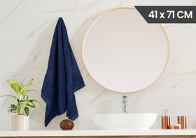 Utopia Towels navy towel undergoing absorbency test, reliable performance.