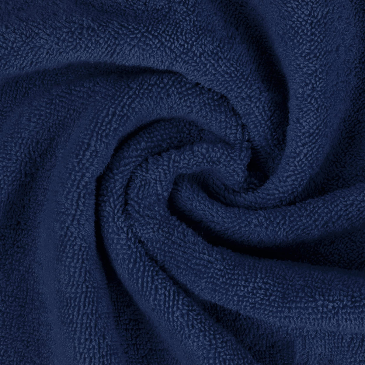 Utopia Towels navy towel on bathroom shelf, ready for quick dry.