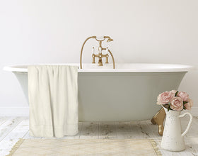 Travel-ready jumbo bath sheet by Utopia Towels packing into luggage.