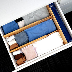 Utoplike bamboo divider with non-slip ends protects drawers and organizer items.