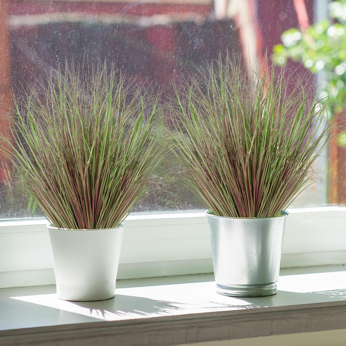 UXORSN kitchen windowsill decor with faux grass for a fresh feel.