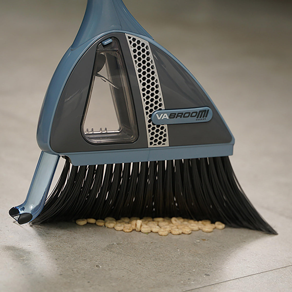 VaBroom built-in vacuum nozzle demonstrates dust and small particle collection.