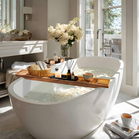VaeFae teak bathtub tray on tub rim showing anti-slip sticker.