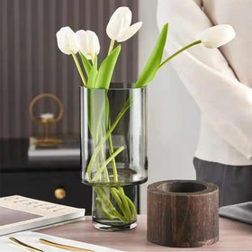 Valemoon clear glass vase with smooth surface showcasing stems.