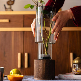 Valemoon wood-base vase in natural finish complements dried bouquets.