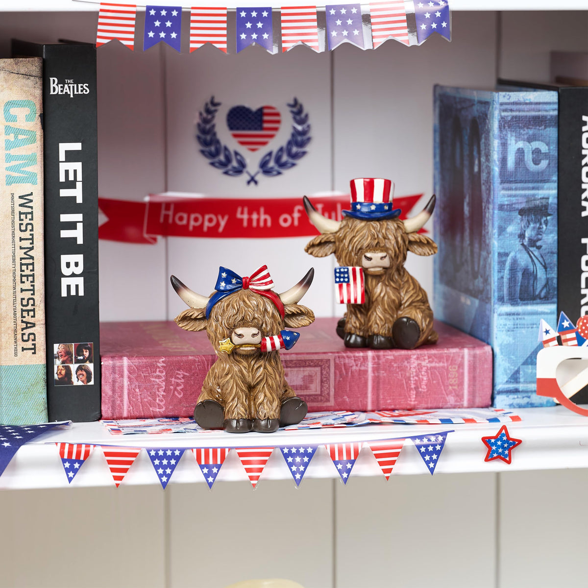 Valery Madelyn cow figurines arranged on a tiered tray for display.