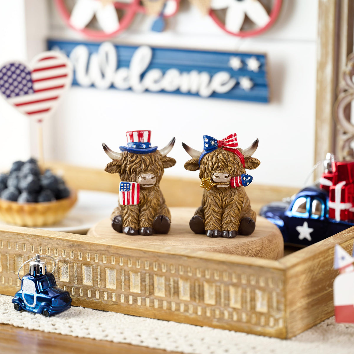 Valery Madelyn Highland cow figurine with stars for festive decor.
