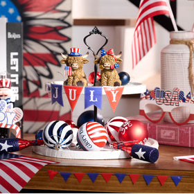 Valery Madelyn cow statues on shelf or desk for Americana vibe.