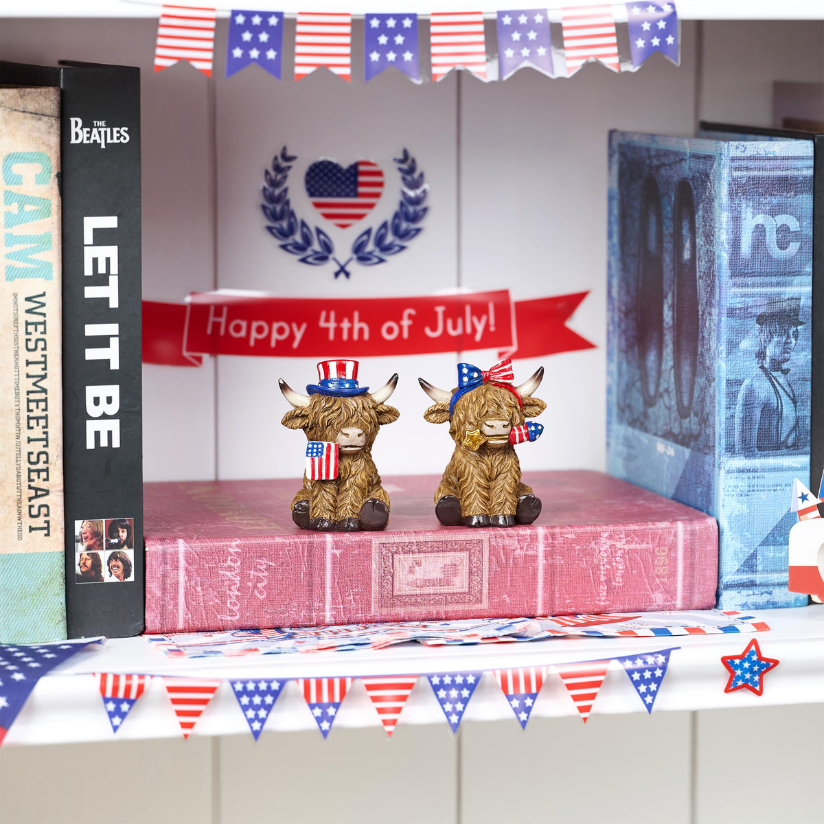 Valery Madelyn patriotic cow pair on a tiered tray for decor.