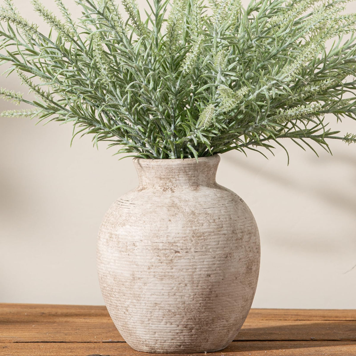Vanselia ceramic flower vase with handcrafted texture adds rustic charm.