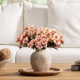 Vanselia ceramic vase bottom includes a non-slip pad for furniture protection.