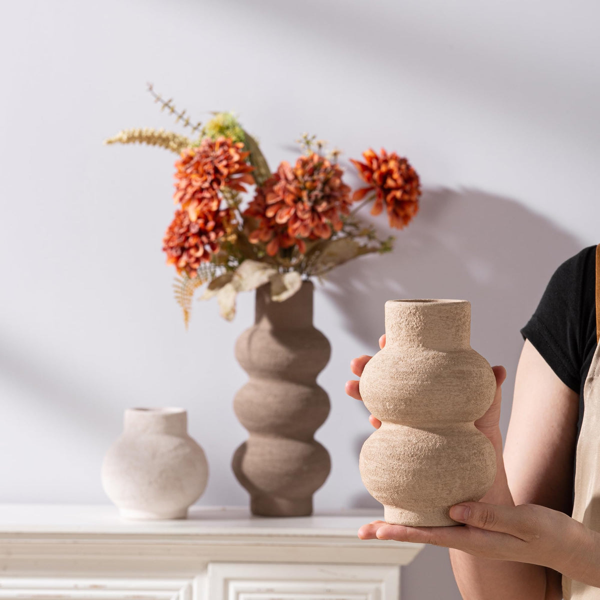 Vanselia ceramic vase set styled on a dining table creates a welcoming focal point.