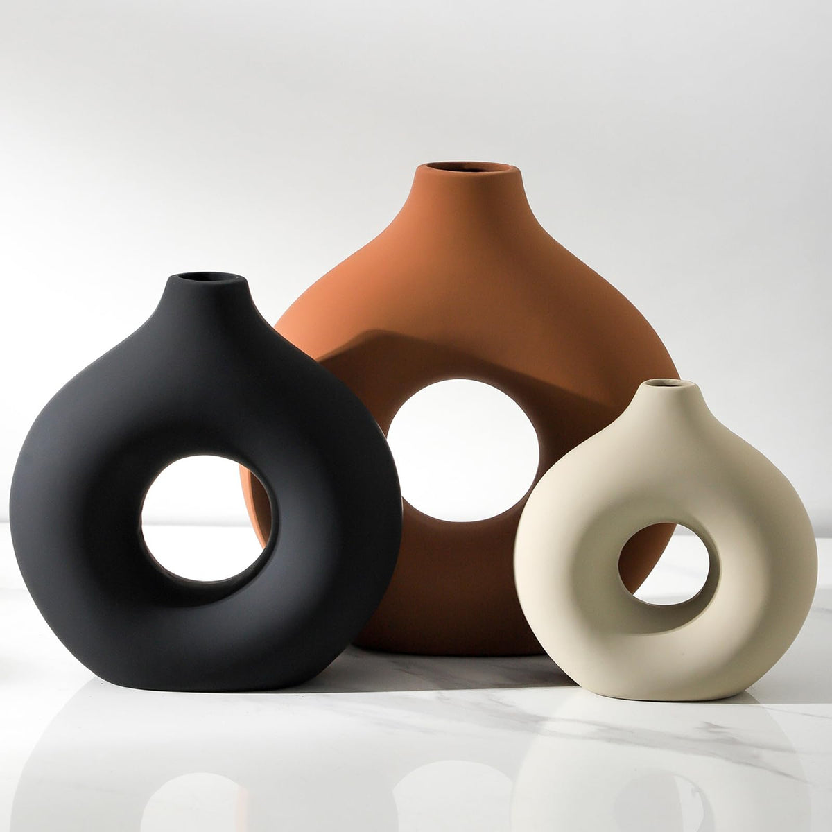 Vanselia donut-shaped large rust ceramic vase, ideal dining-table centerpiece.