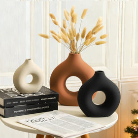 Vanselia donut-shaped small rust ceramic vase, great for windowsills or nightstands.