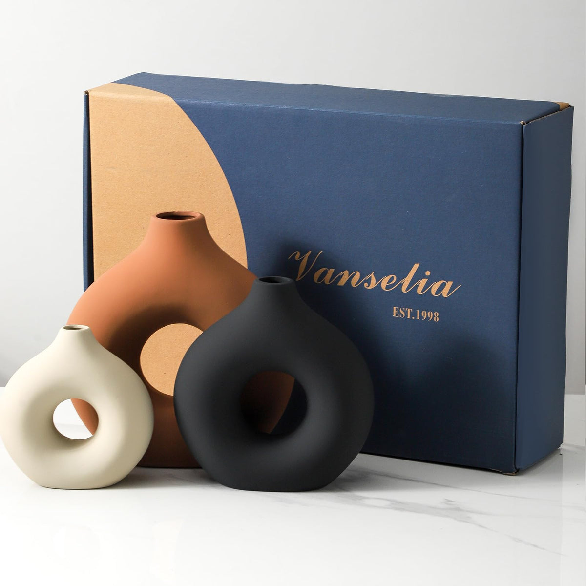 Vanselia handcrafted ceramic vase in rust with a sturdy build.