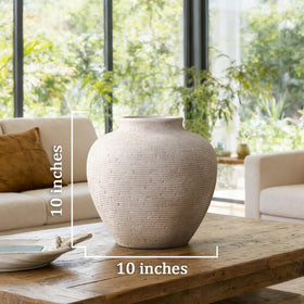 Vanselia handcrafted ceramic vase adds character with subtle variations in texture.