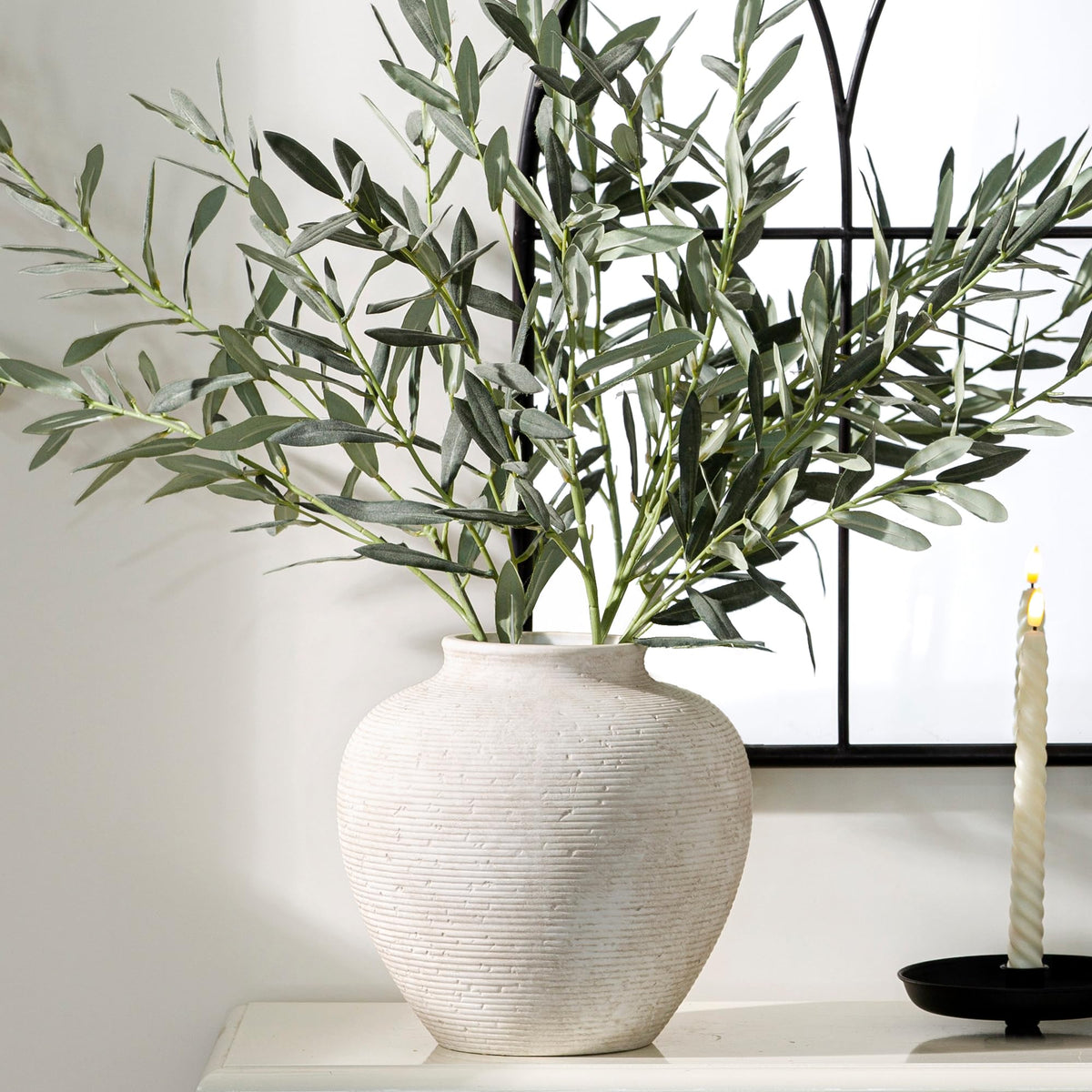 Vanselia tall vase serves as a standalone centerpiece on tables.