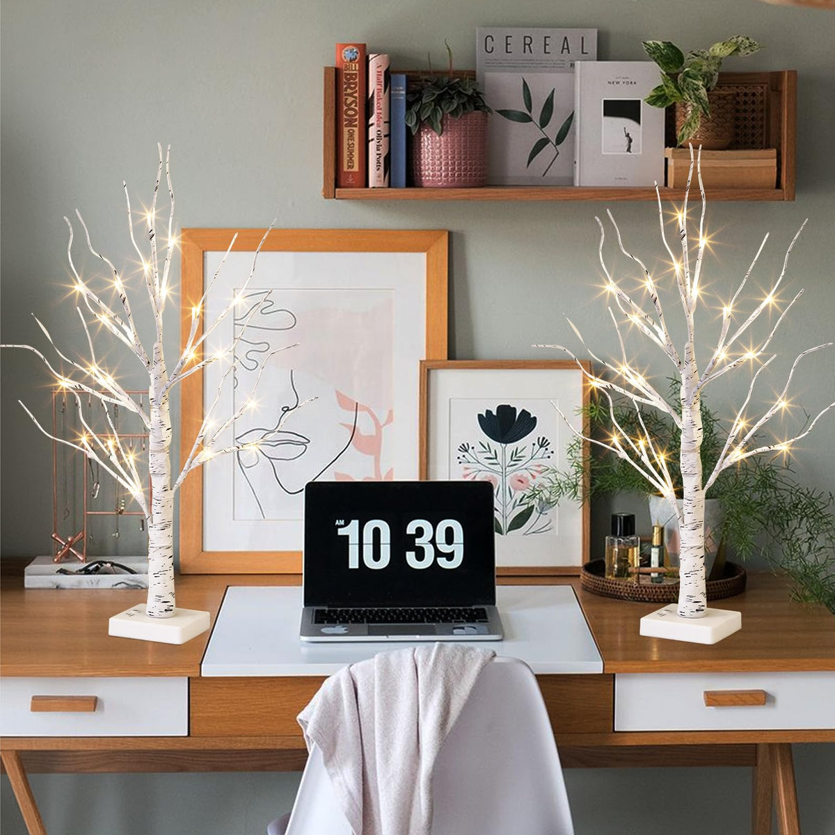 Vanthylit white birch tree mantel display glowing softly in living space.