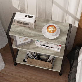 Vantimo 3-Tier Side Table in bedroom used as nightstand keeps essentials within reach.