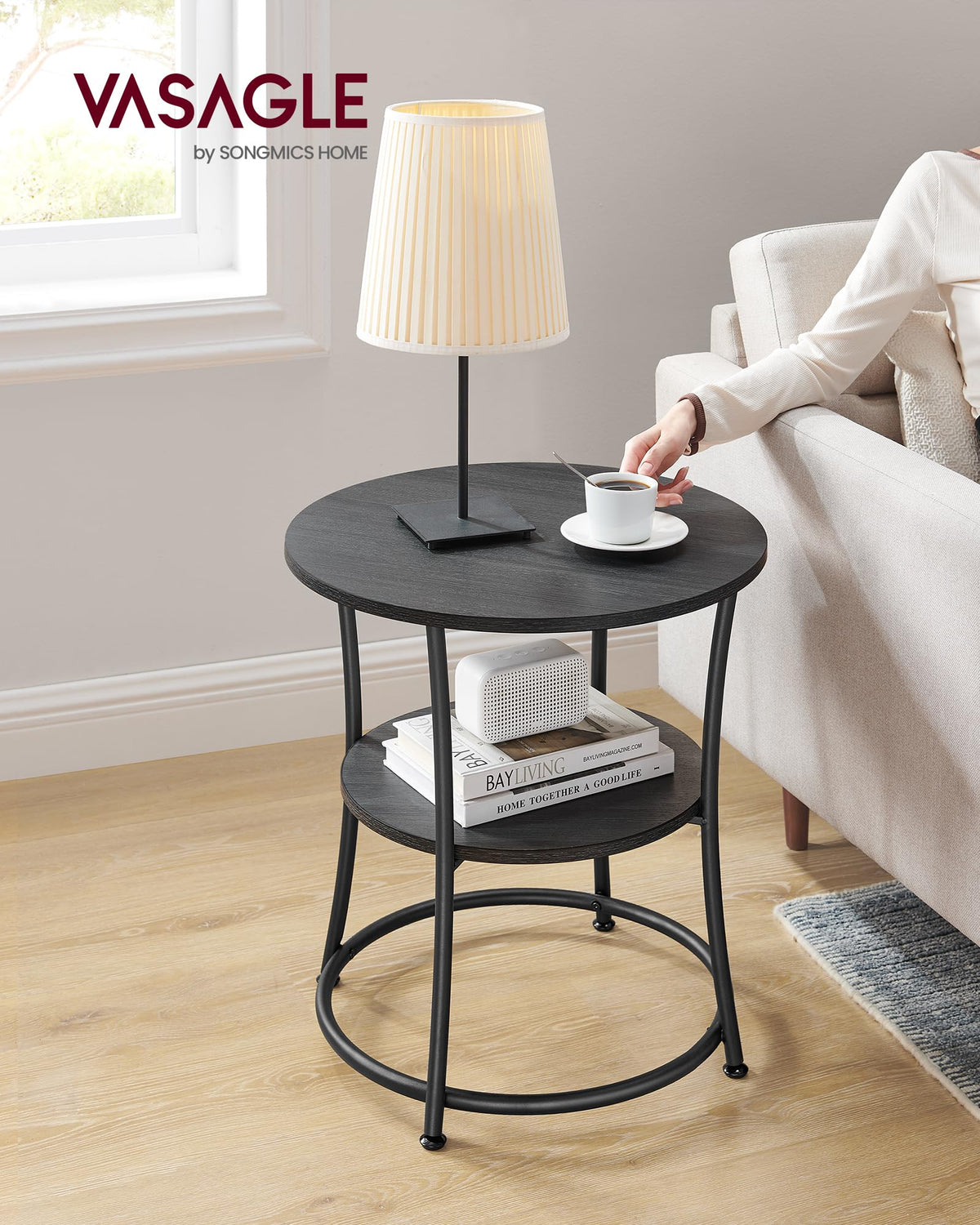 VASAGLE two-shelf round table close-up showing sturdy steel frame and finishes.