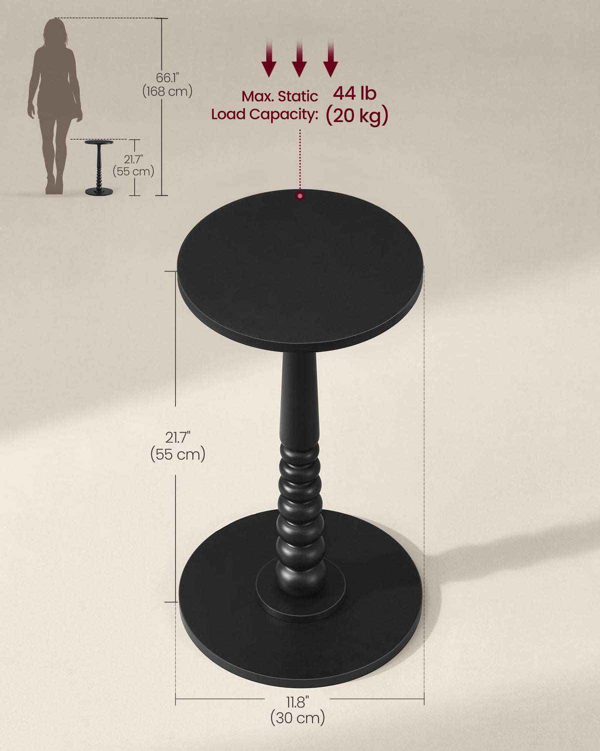 MARIEL ink-black round table showing its minimal, mid-century profile.